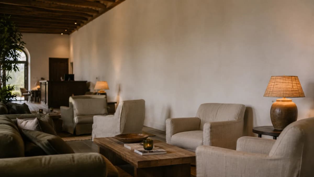 A hotel lounge with a large bare wall, ready for original art